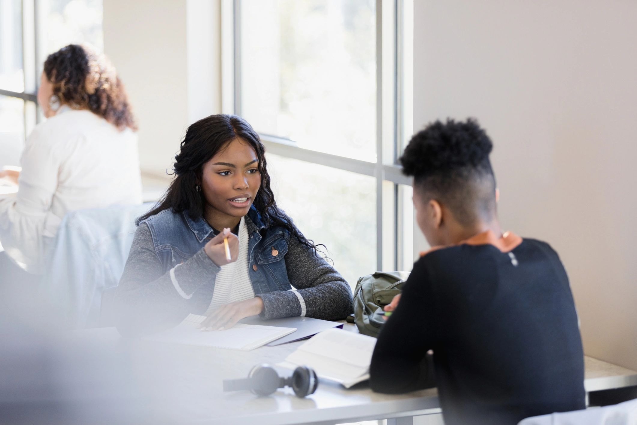 Two students in conversation while studying together