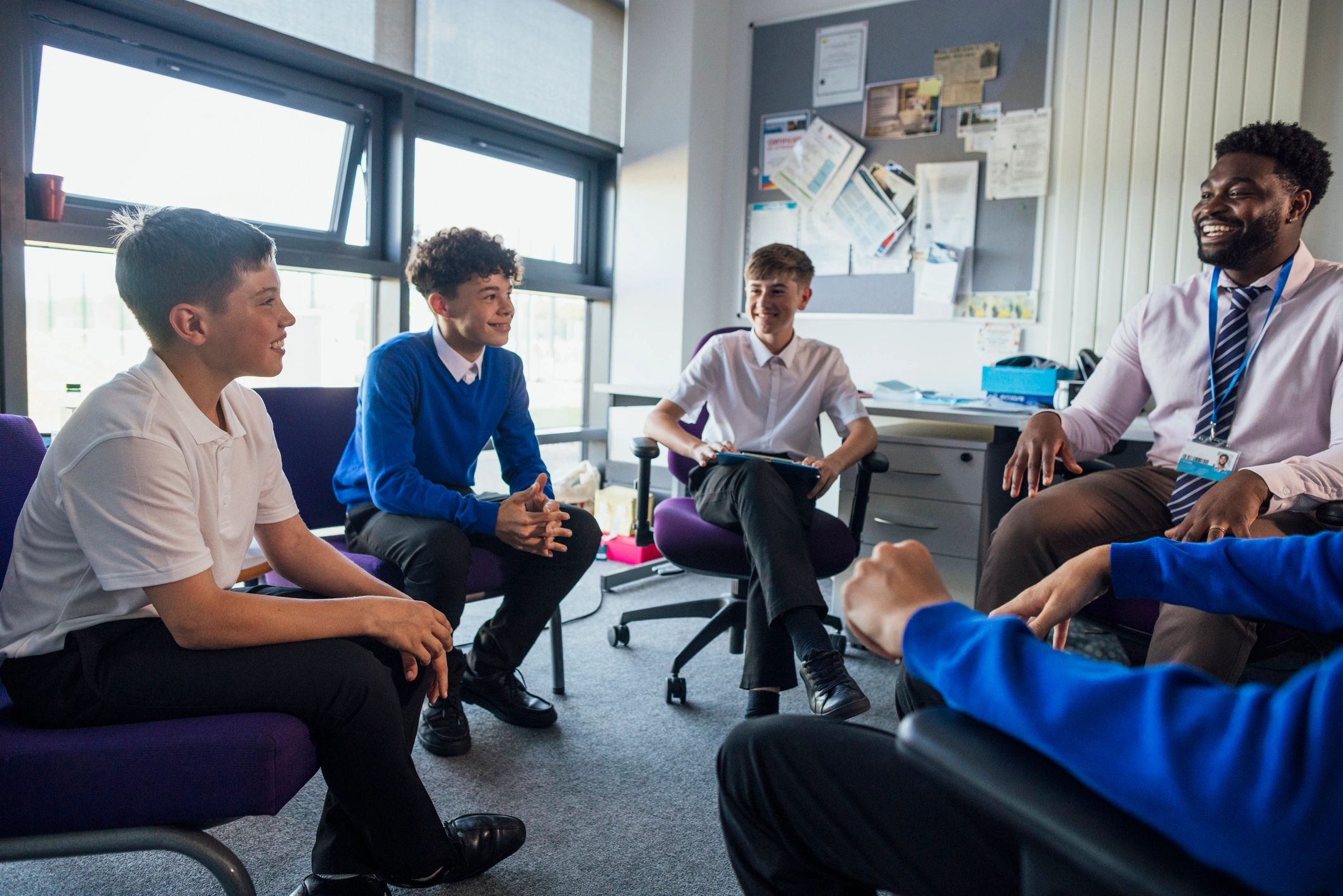 Students and teacher in a supportive group discussion