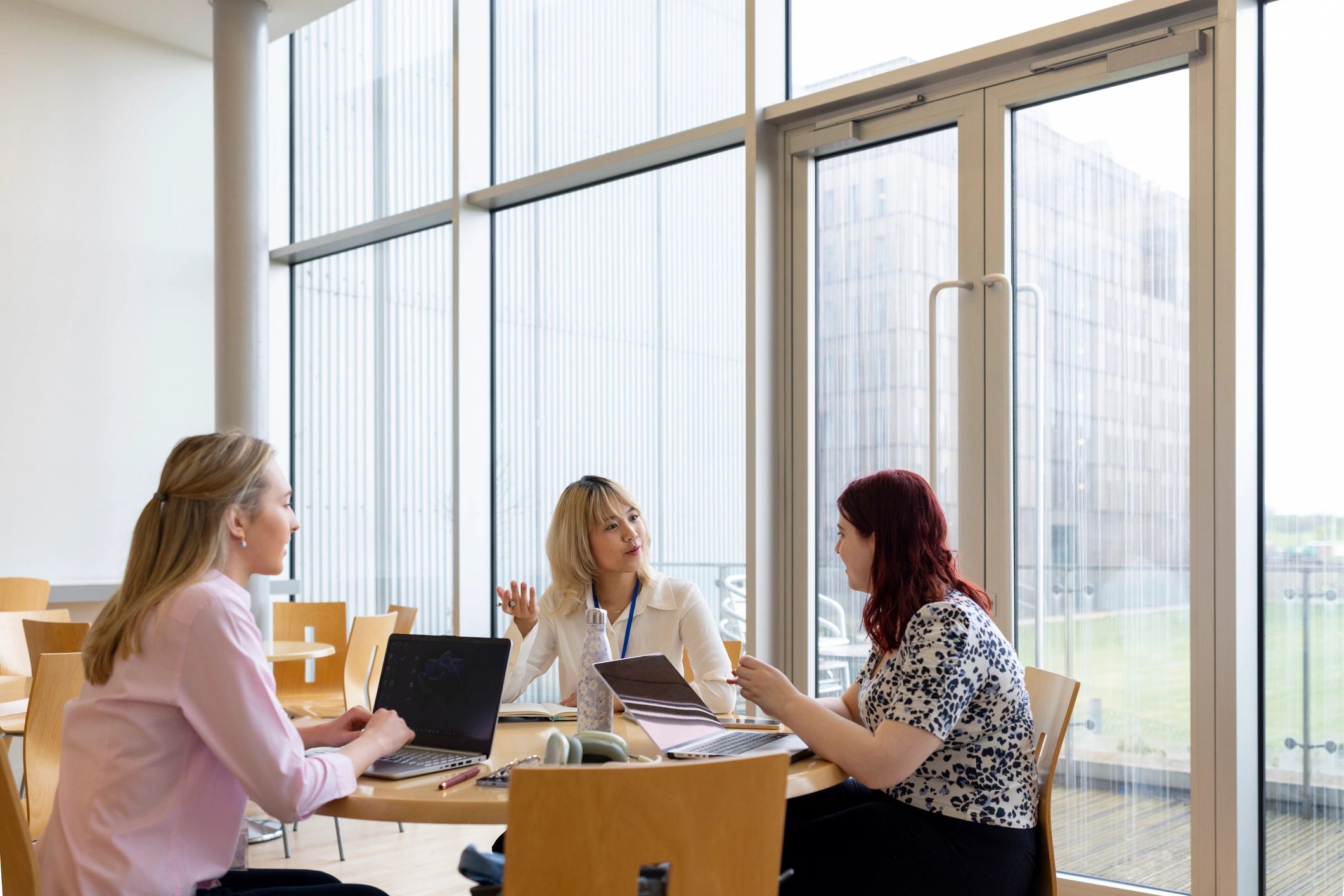 Students studying together in a bright common area