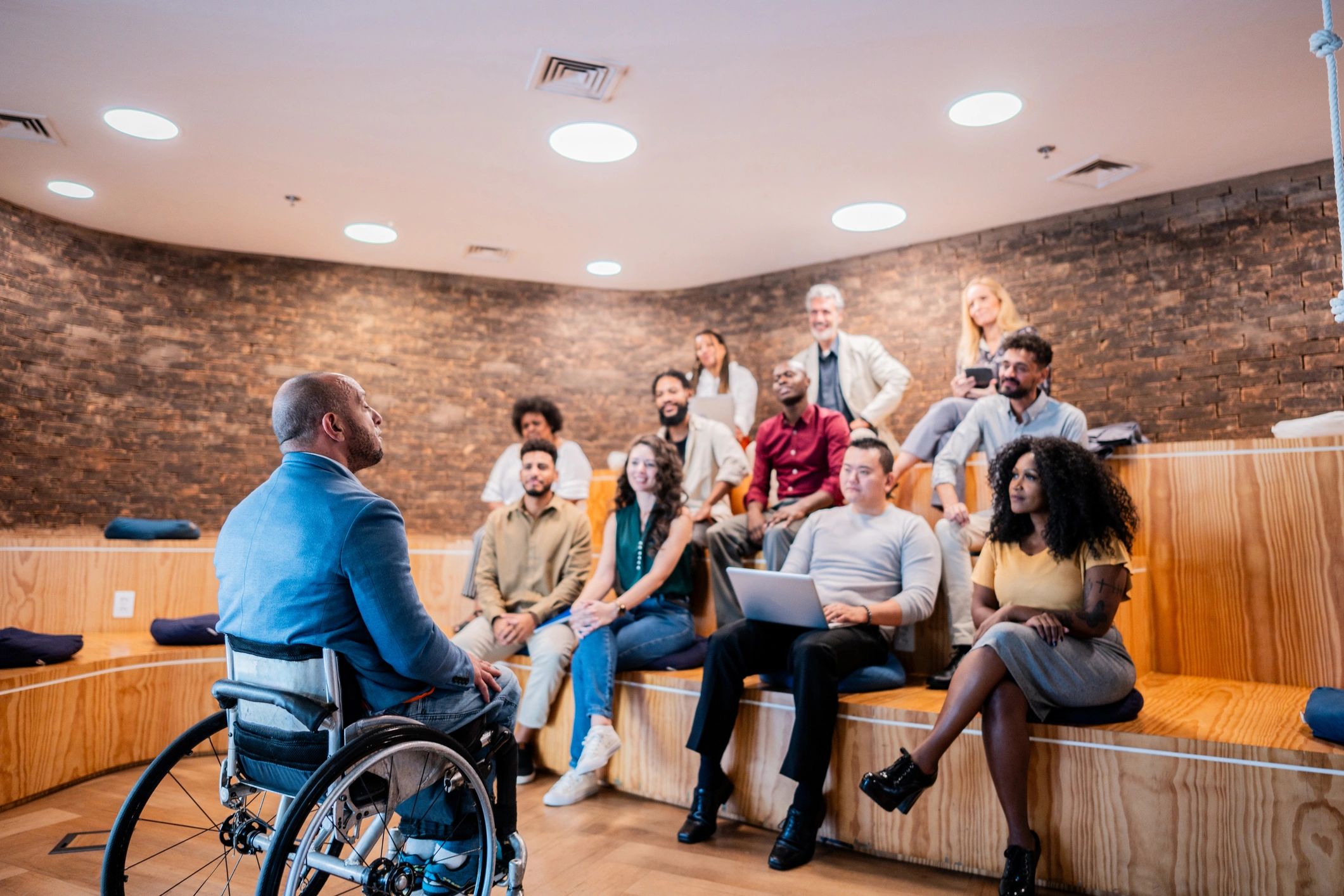 Wheelchair user speaking during a presentation