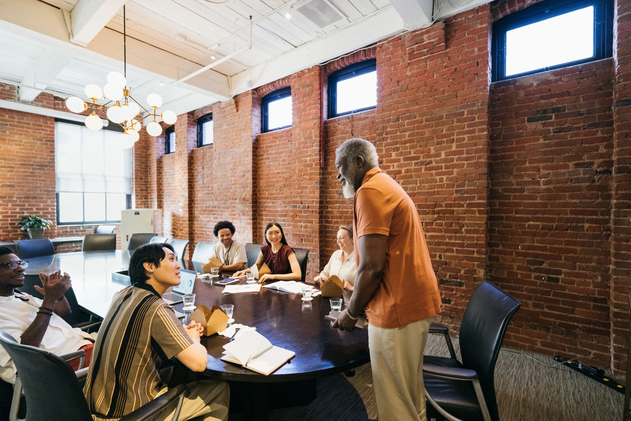 Community volunteers meeting together around a table